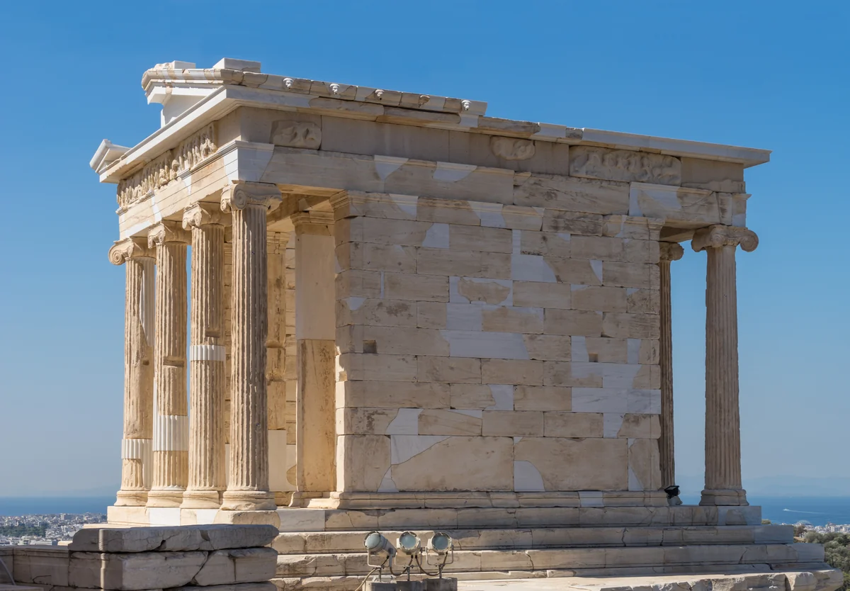The Parthenon on the Athens Acropolis under a clear sky.