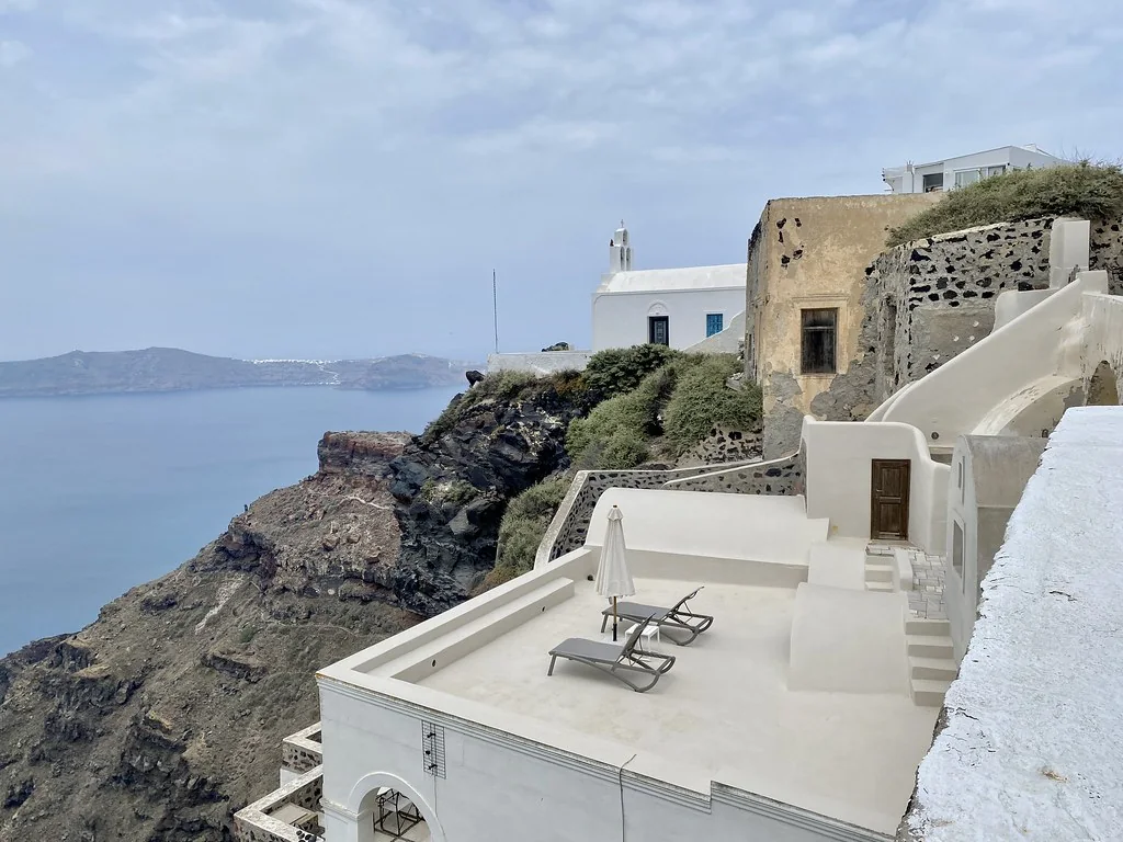 A terrace and white houses above the caldera at Imerovigli, Santorini.